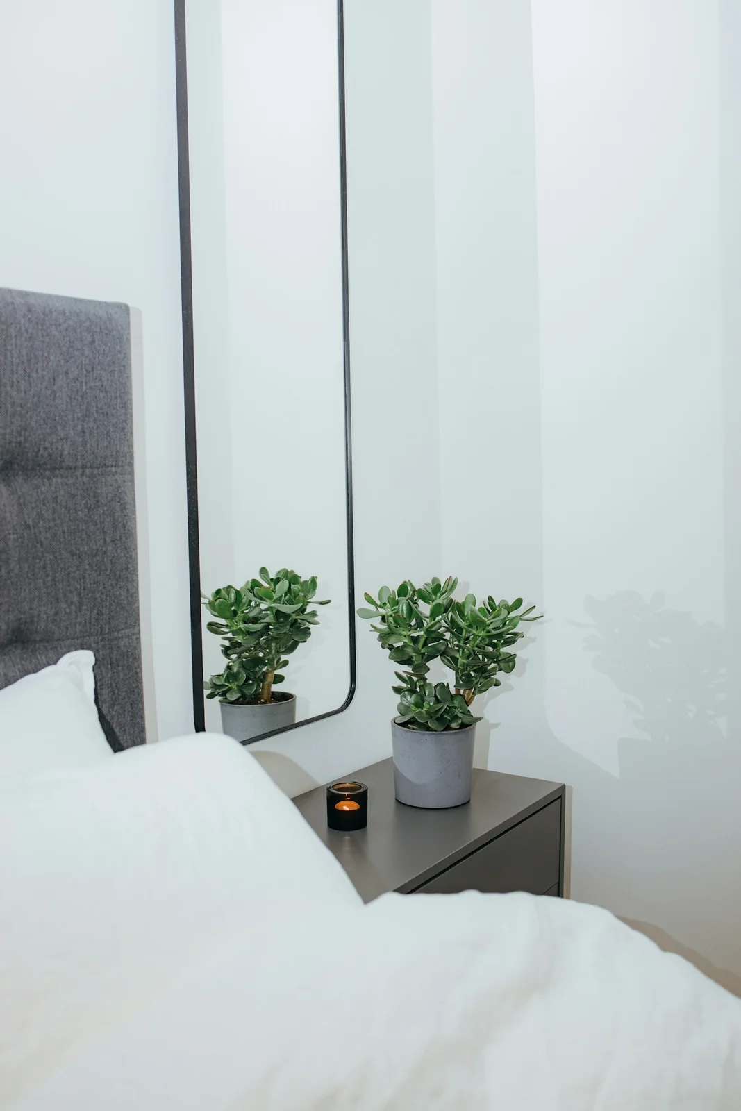 Mirror · Tall mirror beside a bed — Robert Arnar, Unsplash License